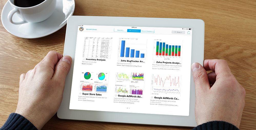 person viewing zoho analytics on tablet with promo text